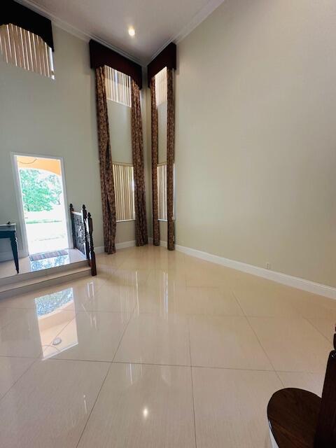 5245 Sancerre Circle Lake Worth, FL 33463 - Photo 8 of 46 a view of an empty room with a window