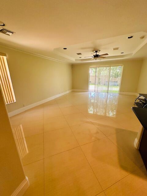5245 Sancerre Circle Lake Worth, FL 33463 - Photo 10 of 46 a view of an empty room with a window