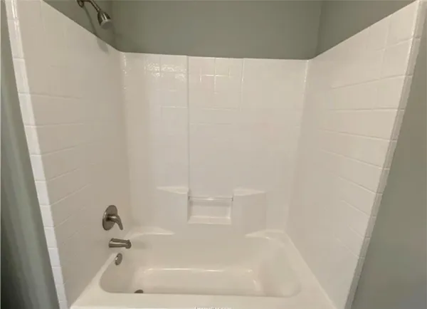 a close up of a bathtub in a bathroom