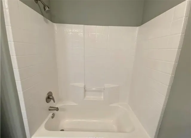 a close up of a bathtub in a bathroom