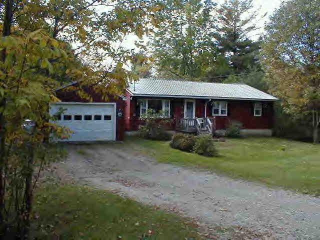 238 East Windsor Road Peru, MA 01235 - Photo 1 of 2 a front view of a house with garden