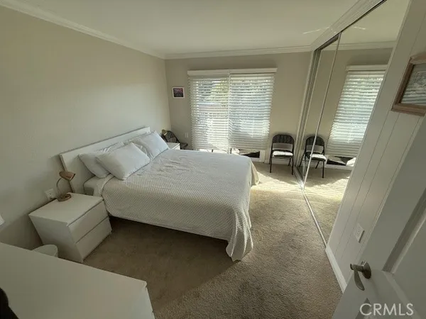 a bedroom with furniture and a window