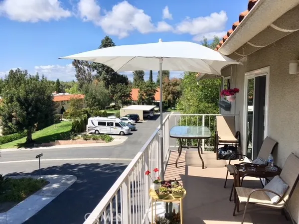 a view of a roof with sitting area