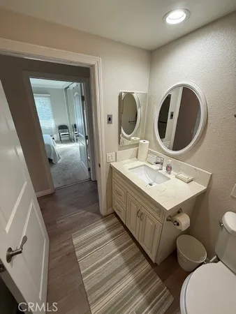 a bathroom with a double vanity sink and a mirror