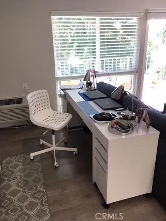 a living room with furniture and window
