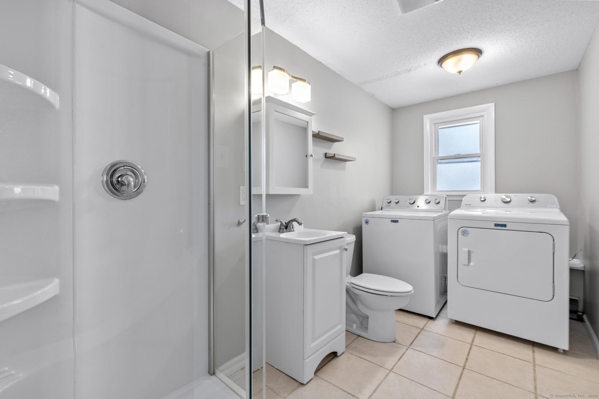 8 Kings Road Simsbury, CT 06089 - Photo 11 of 20 Dual Function - Full Bath and Laundry room on the lower level.