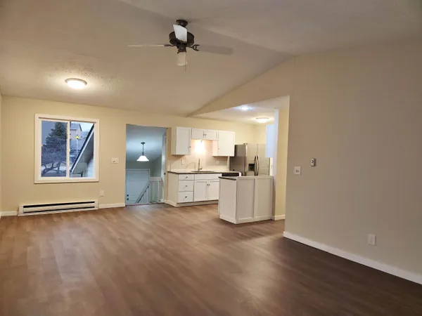 a kitchen with a sink and refrigerator