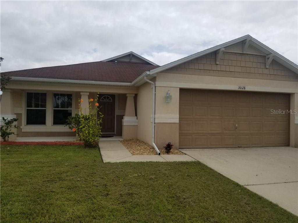 3028 Park Ridge Avenue Mulberry, FL 33860 - Photo 1 of 1 a front view of house with yard
