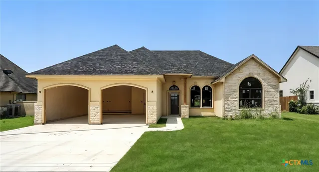 a view of a house with a garden