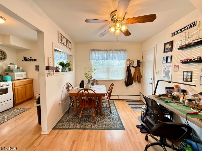 1241 Valley Road, Unit 1241 Wayne, NJ 07470 - Photo 3 of 12 a living room with furniture and a wooden floor