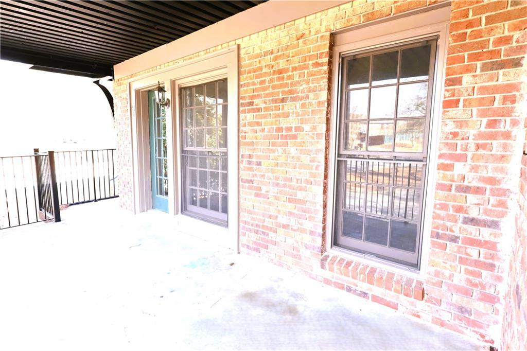 3091 Colonial Way, Unit H2 Chamblee, GA 30341 - Photo 3 of 17 a view of an empty room with a balcony
