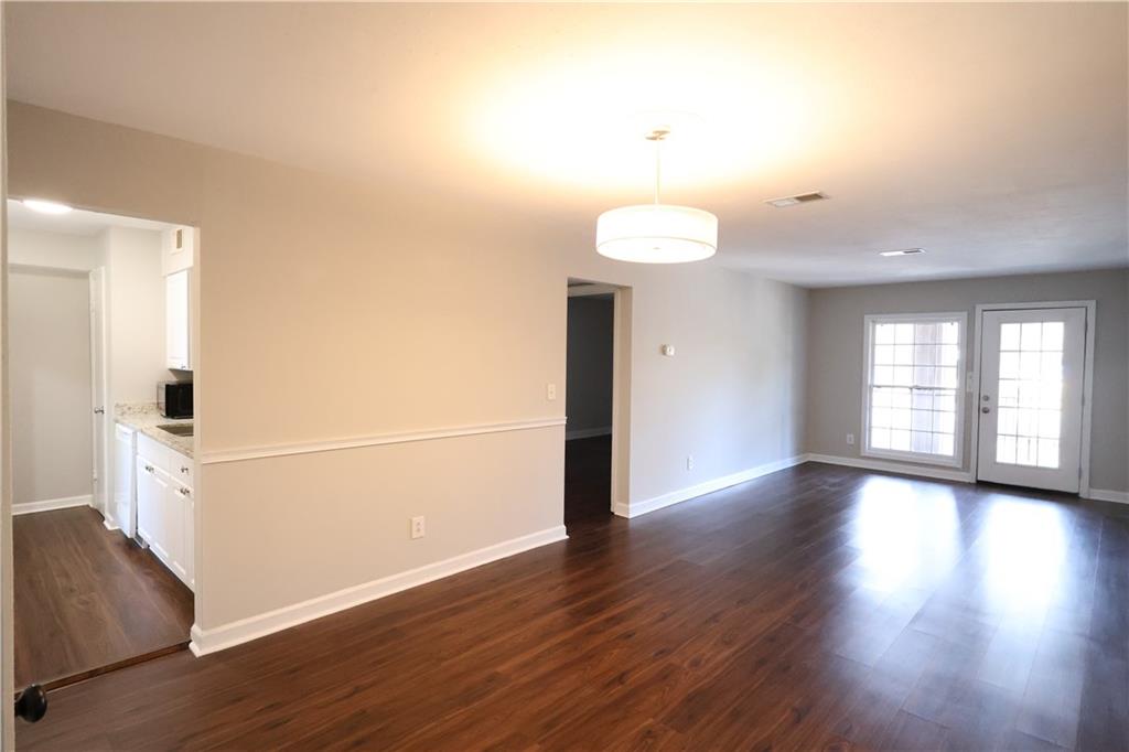 3091 Colonial Way, Unit H2 Chamblee, GA 30341 - Photo 4 of 17 a view of livingroom with hardwood floor and window