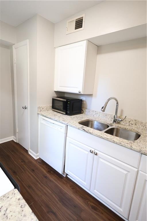 3091 Colonial Way, Unit H2 Chamblee, GA 30341 - Photo 8 of 17 a kitchen with a sink cabinets and wooden floor