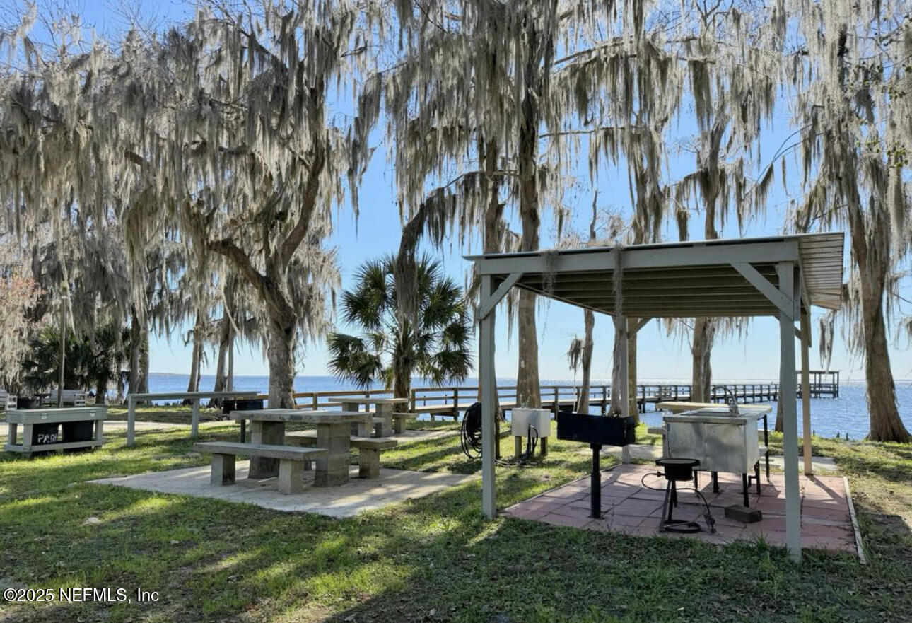 107 Georgetown Point Road Georgetown, FL 32139 - Photo 8 of 14 a swimming pool with outdoor seating and yard