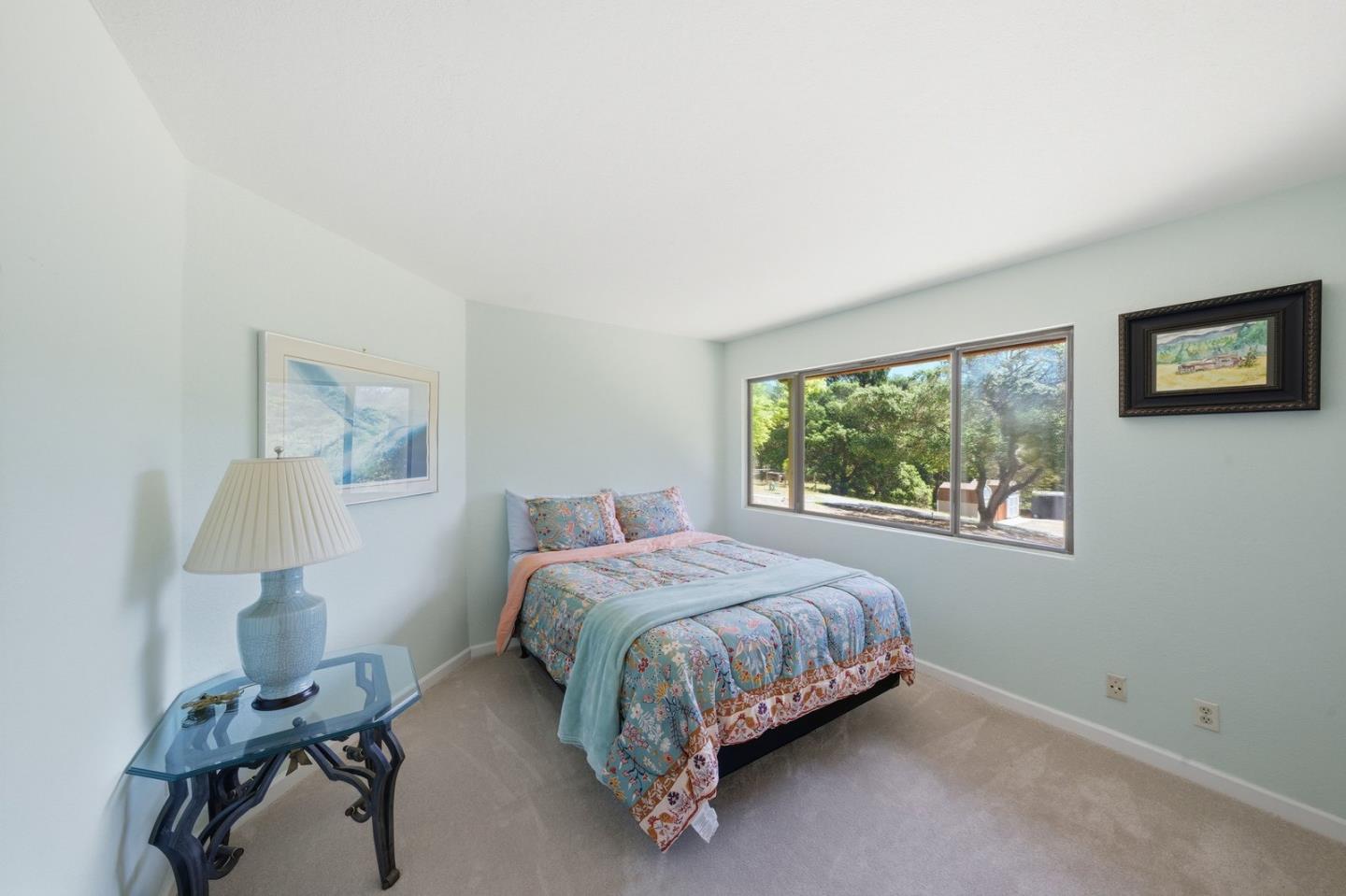 701 Day Valley Road Aptos, CA 95003 - Photo 22 of 43 a bed sitting in a bedroom next to a window