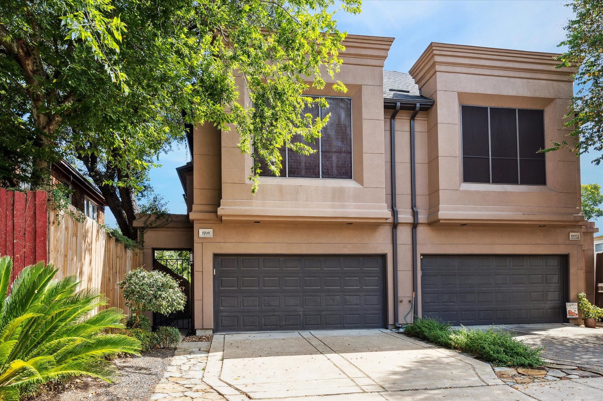 a front view of a house with garden