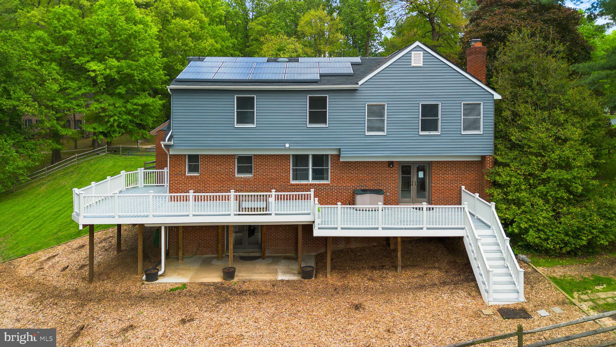 15220 Redgate Drive Silver Spring, MD 20905 - Photo 63 of 65 a view of a house with backyard porch and sitting area