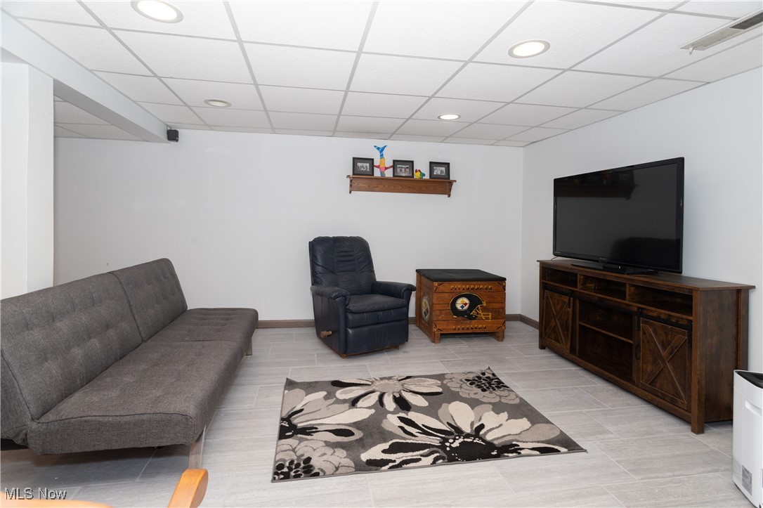 4171 Laubert Road Atwater, OH 44201 - Photo 8 of 42 Lower level family room featuring a paneled ceiling