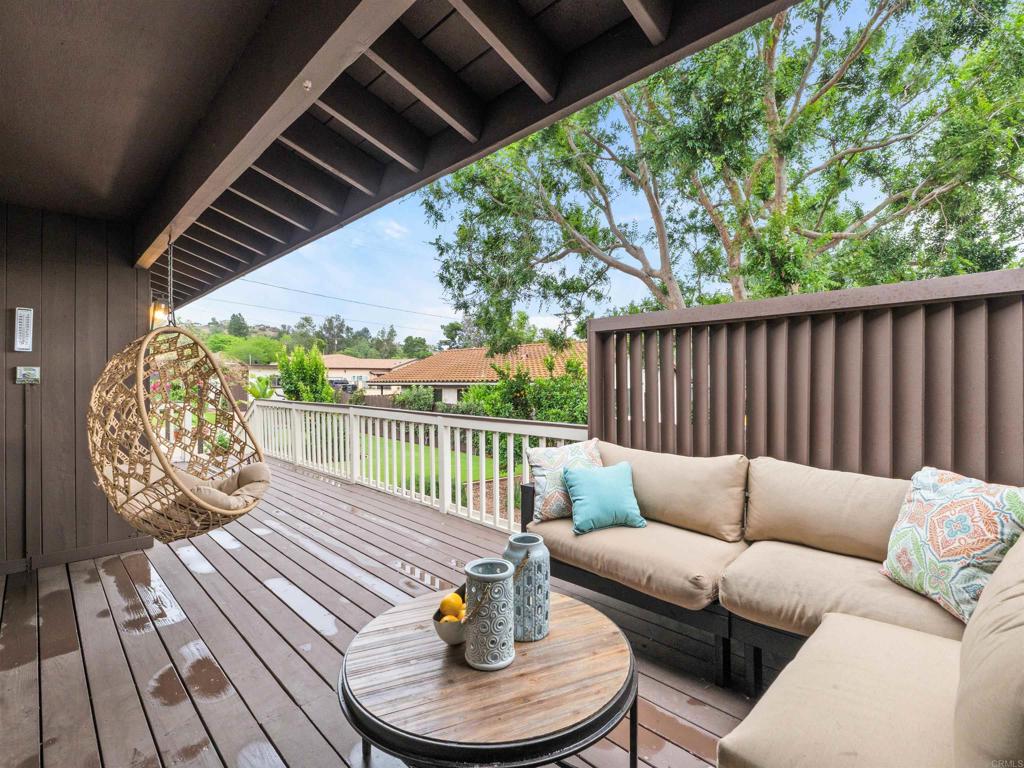 13737 Temple Street Poway, CA 92064 - Photo 31 of 38 a balcony with furniture and wooden floor