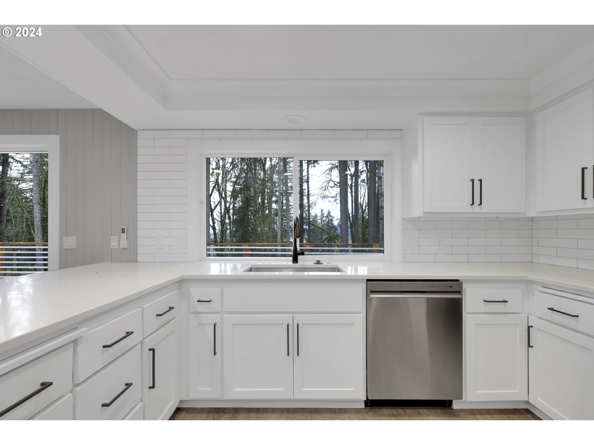 88164 Chita Loop Springfield, OR 97478 - Photo 16 of 48 a kitchen with white cabinets and window