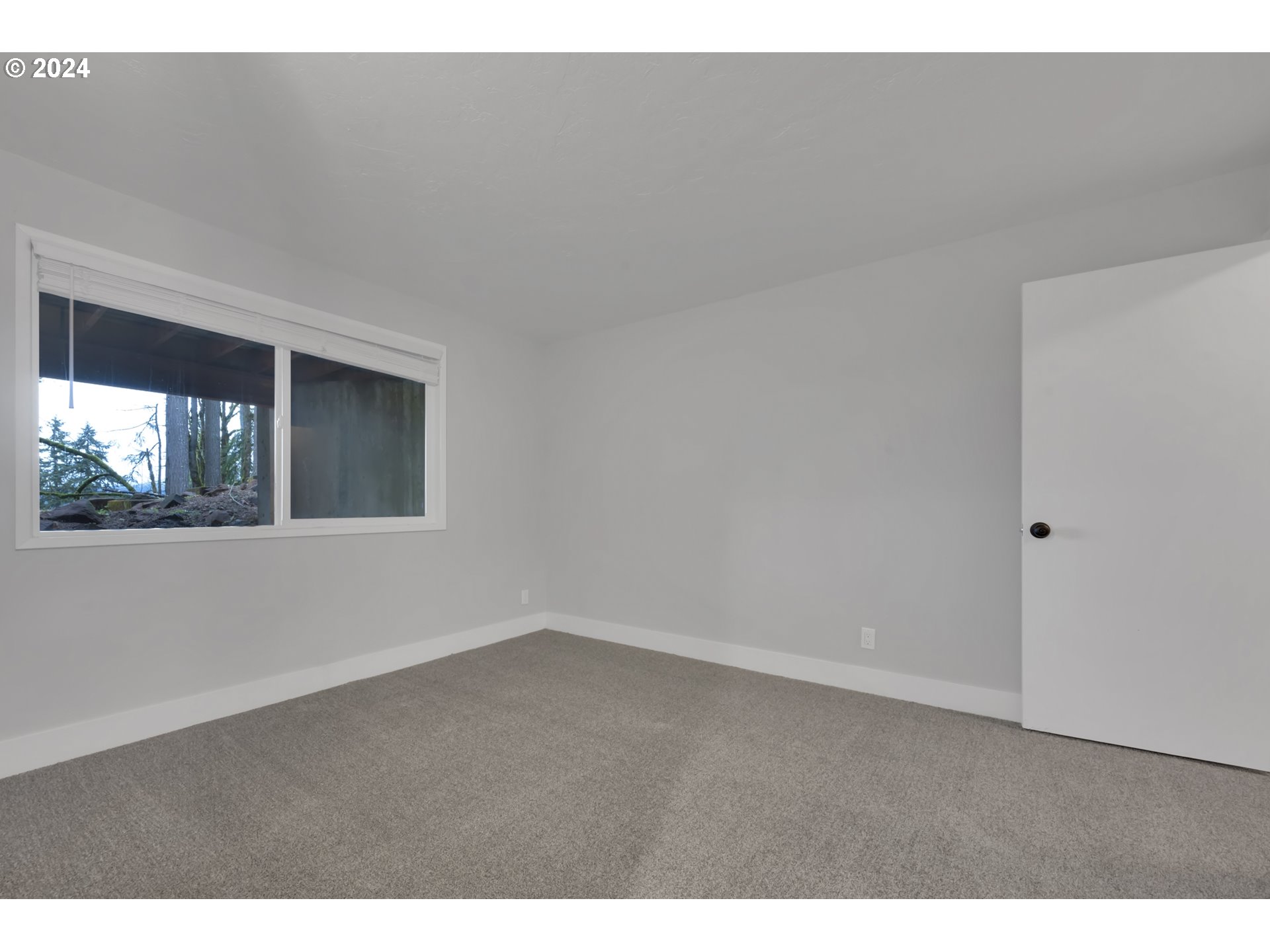 88164 Chita Loop Springfield, OR 97478 - Photo 28 of 48 a view of an empty room with a window