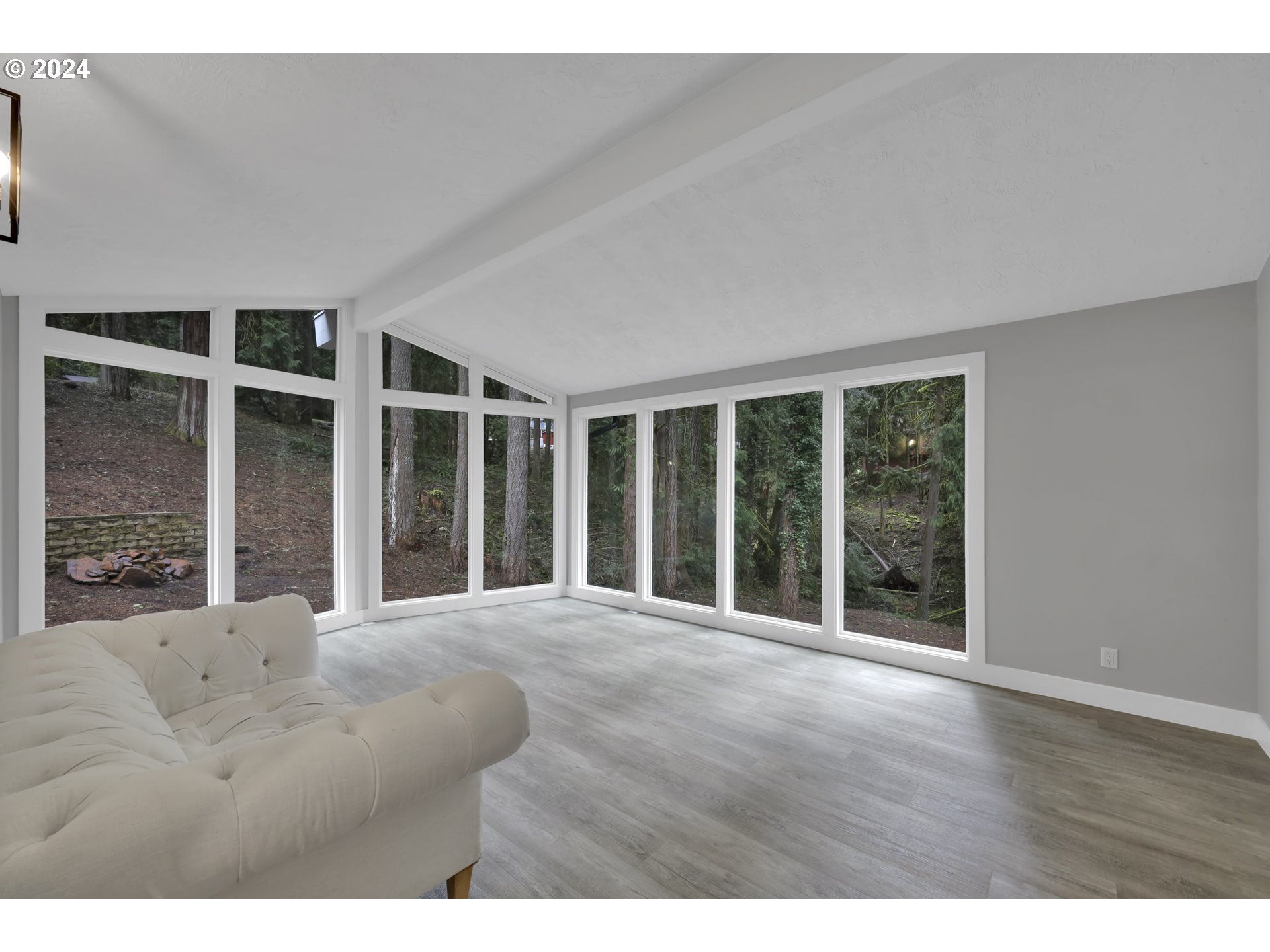 88164 Chita Loop Springfield, OR 97478 - Photo 6 of 48 a view of an empty room with wooden floor and windows