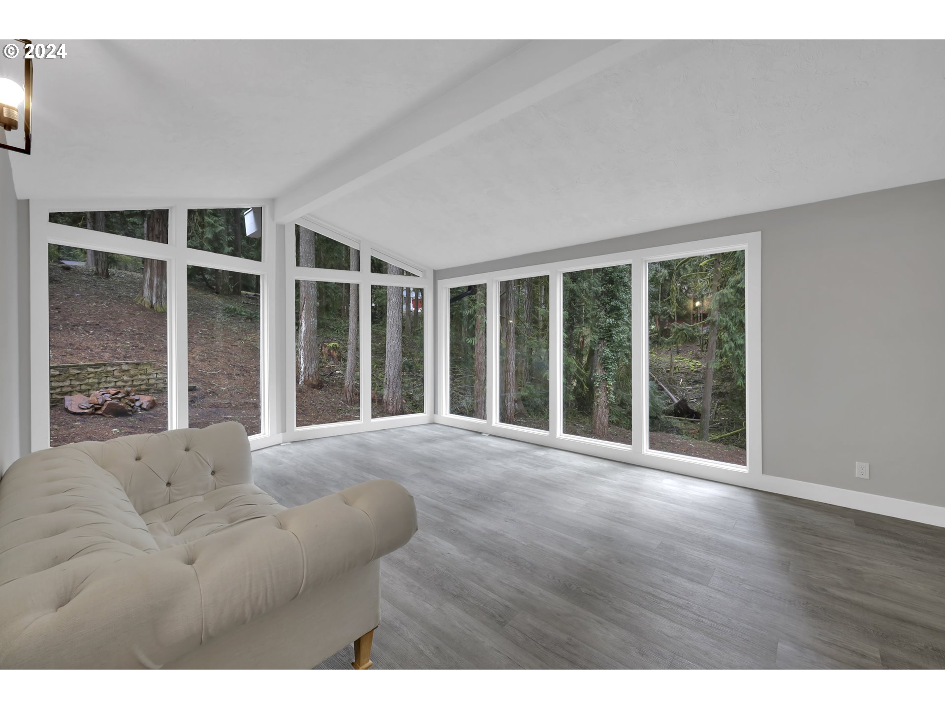 88164 Chita Loop Springfield, OR 97478 - Photo 7 of 48 a view of an empty room with wooden floor and a window