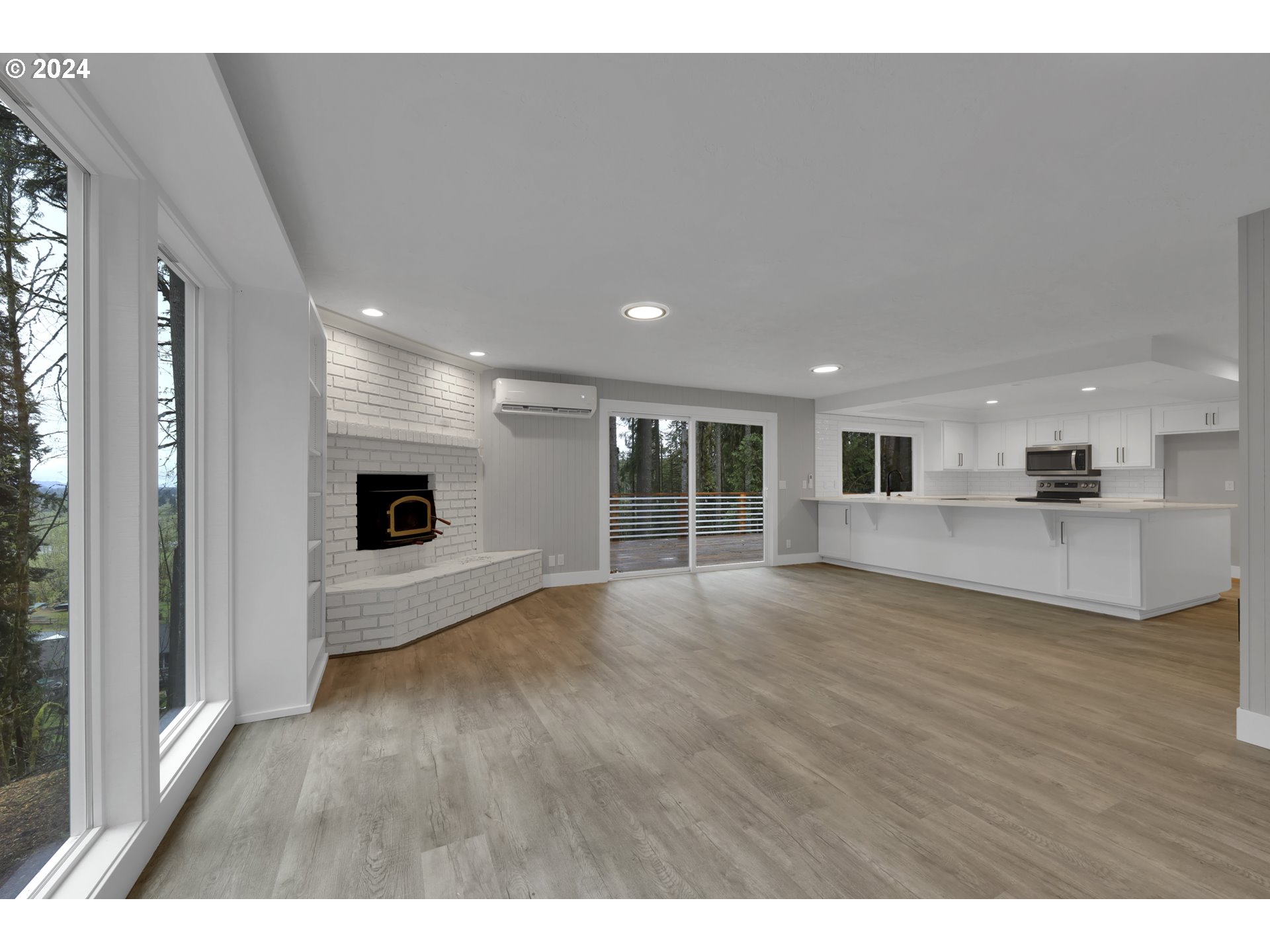 88164 Chita Loop Springfield, OR 97478 - Photo 9 of 48 a view of an empty room with wooden floor and a window