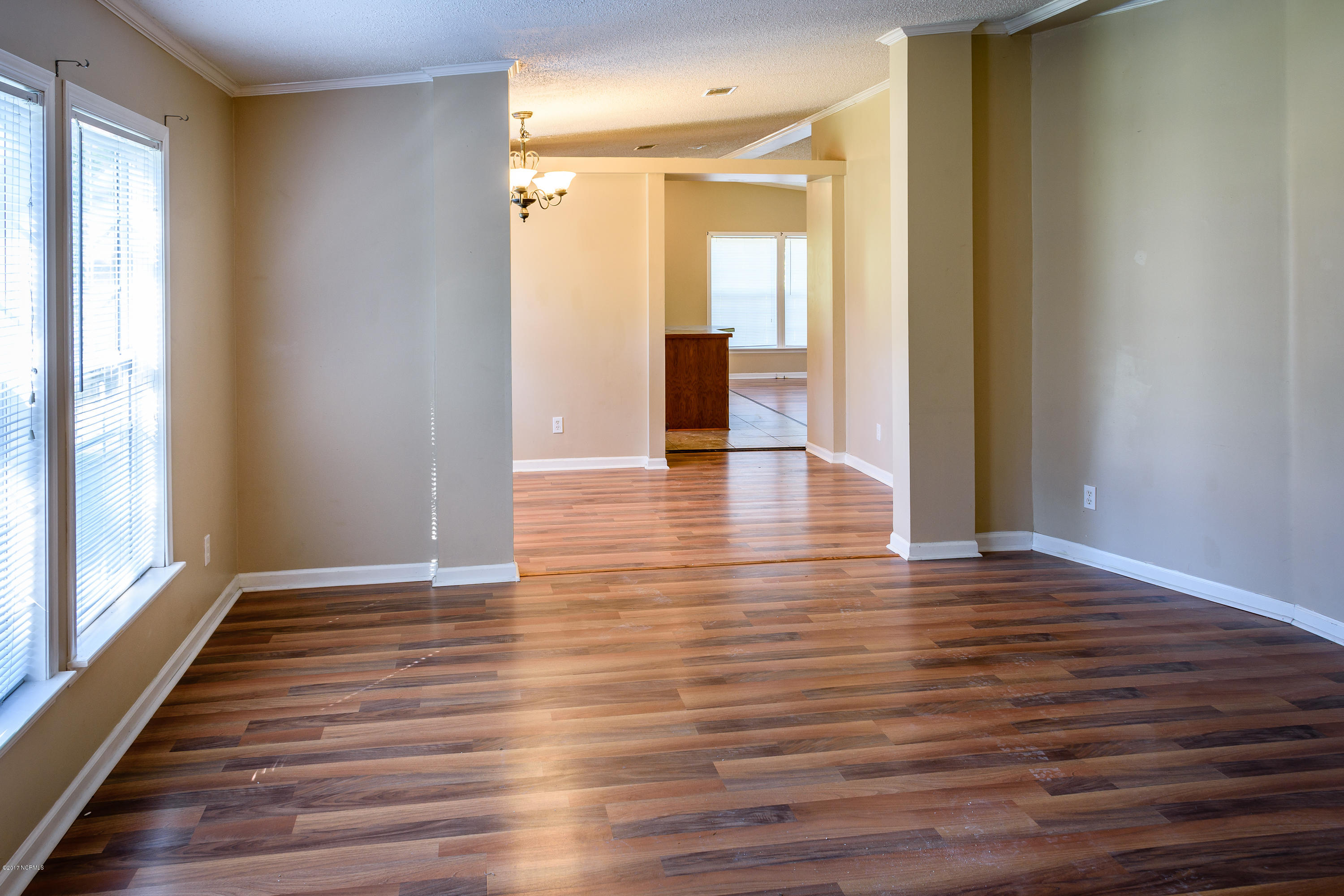 189 Newbold Road Jacksonville, NC 28540 - Photo 14 of 39 Second living room looking towards the dining room and kitchen.