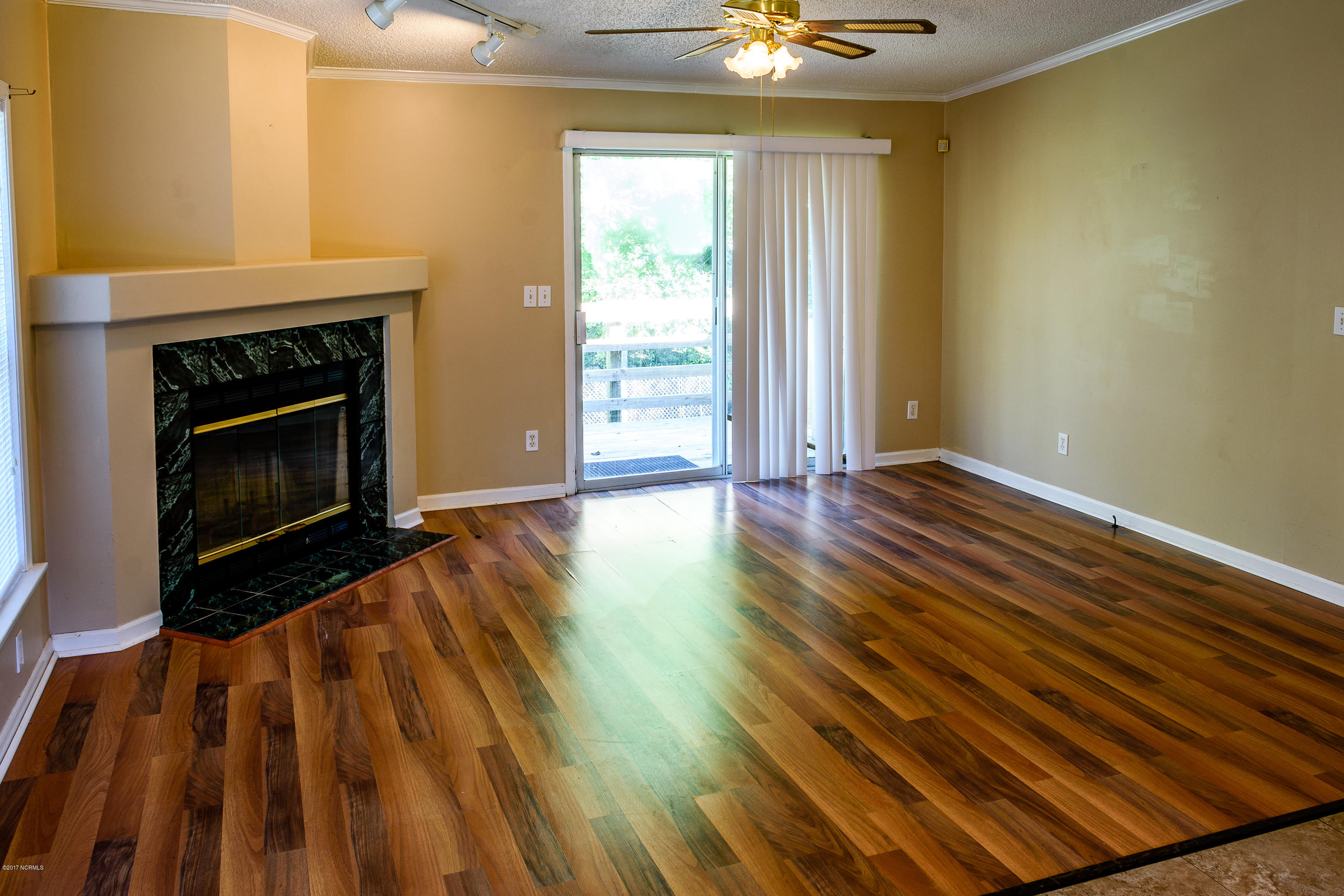 189 Newbold Road Jacksonville, NC 28540 - Photo 6 of 39 Living room 1 with fireplace