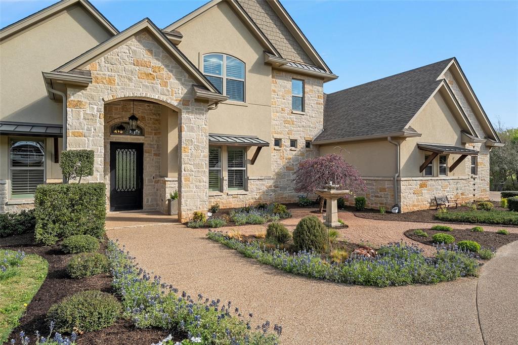14690 Chapel Road Lorena, TX 76655 - Photo 2 of 40 a view of a white house with a small yard and plants