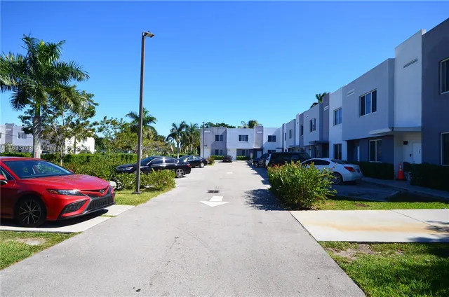 a view of a street with cars
