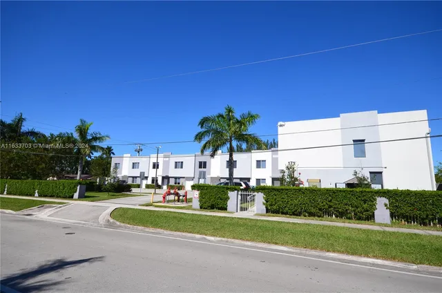 a view of a street with a houses