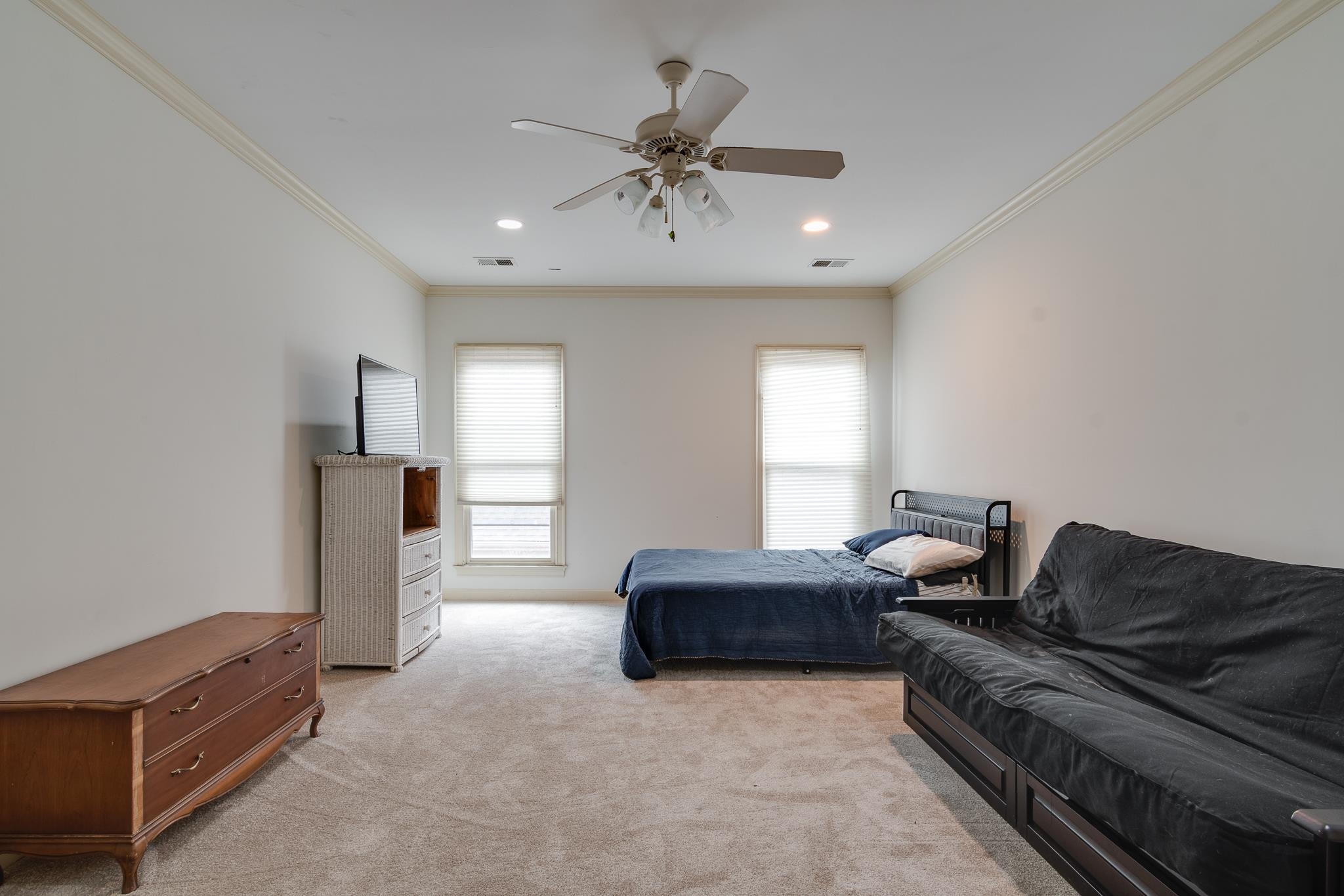 226 North White Station Road Memphis, TN 38117 - Photo 21 of 31 Carpeted bedroom featuring ceiling fan and ornamental molding