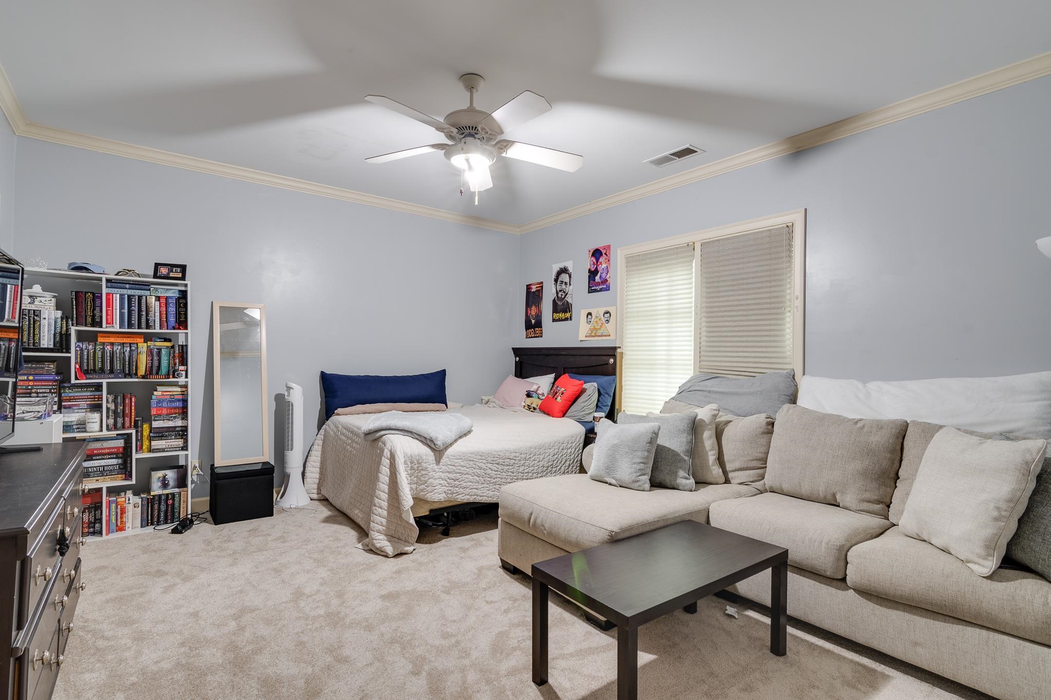 226 North White Station Road Memphis, TN 38117 - Photo 23 of 31 Carpeted bedroom with ornamental molding and ceiling fan