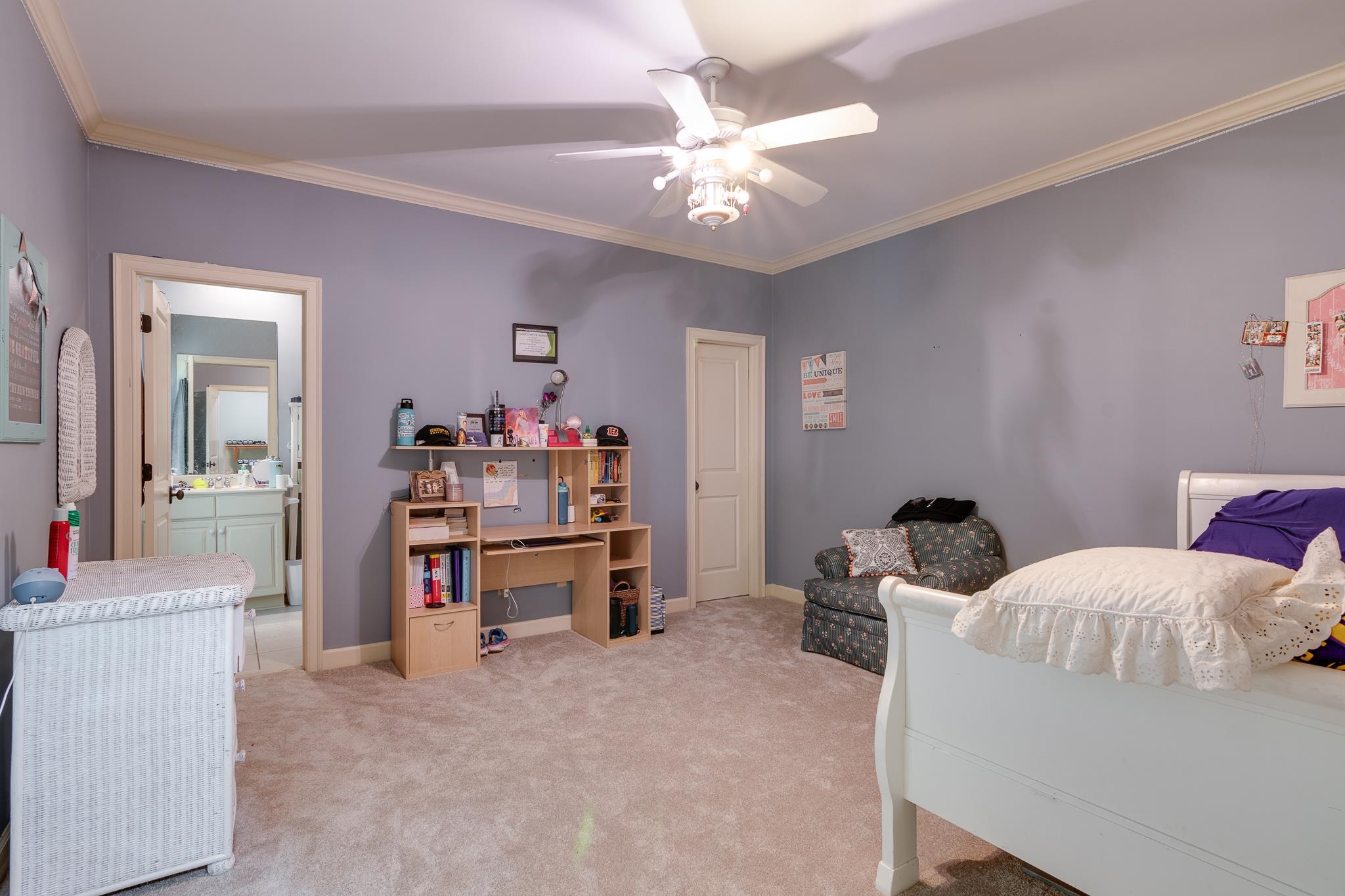 226 North White Station Road Memphis, TN 38117 - Photo 24 of 31 Bedroom with ceiling fan, connected bathroom, light carpet, and ornamental molding