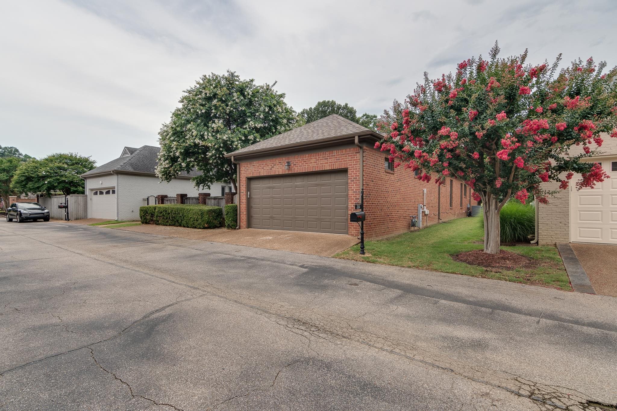 226 North White Station Road Memphis, TN 38117 - Photo 25 of 31 a front view of a house with a yard and garage