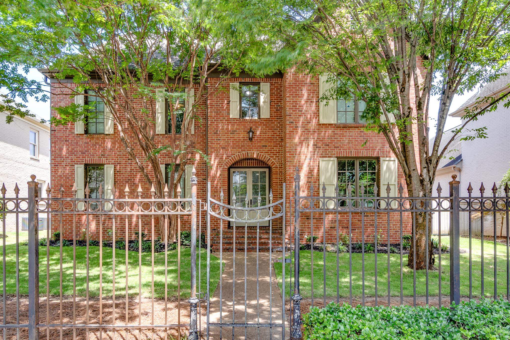 226 North White Station Road Memphis, TN 38117 - Photo 27 of 31 a front view of a house with a garden and plants