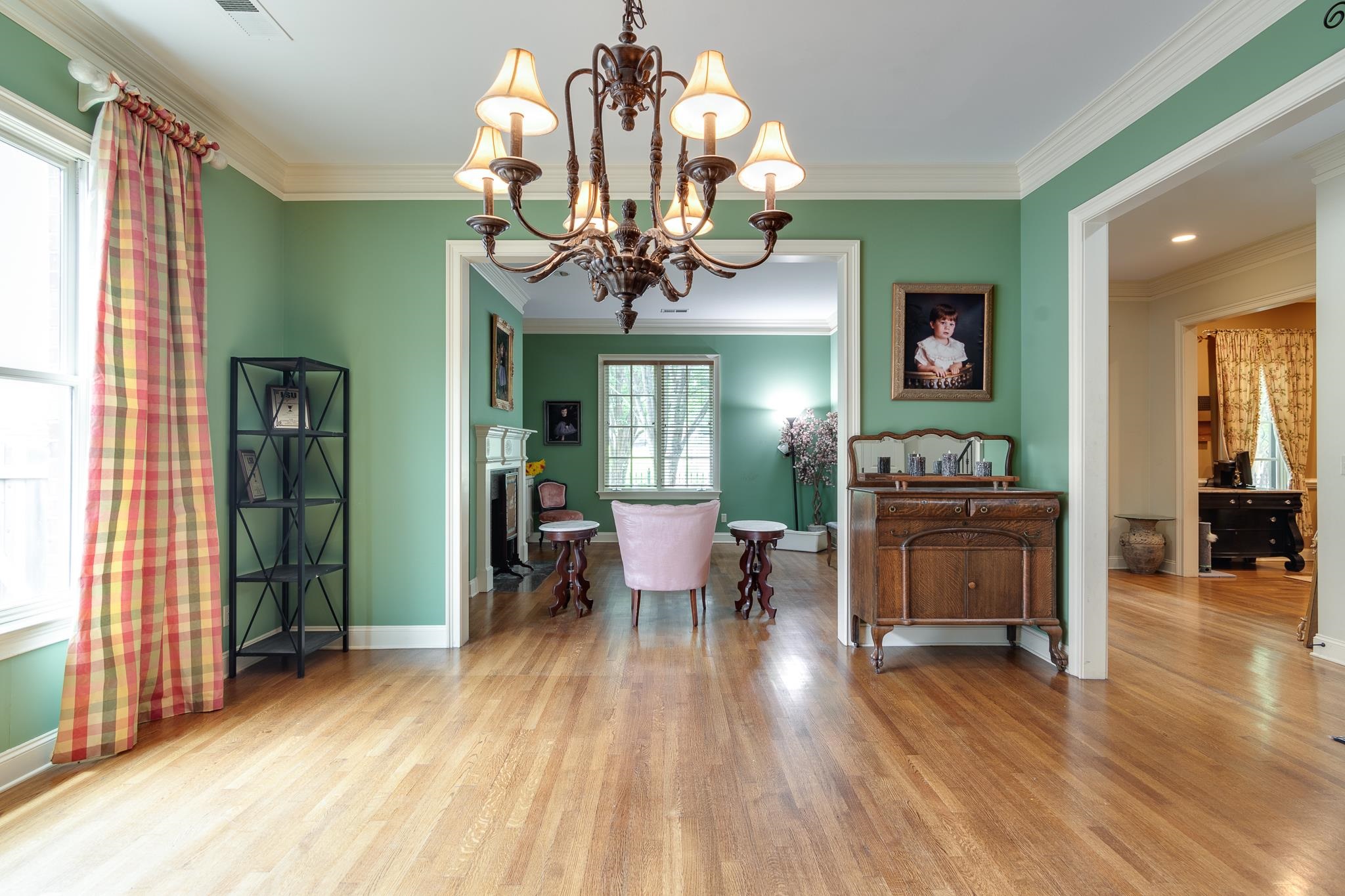 226 North White Station Road Memphis, TN 38117 - Photo 6 of 31 a view of a dining room with furniture wooden floor and chandelier