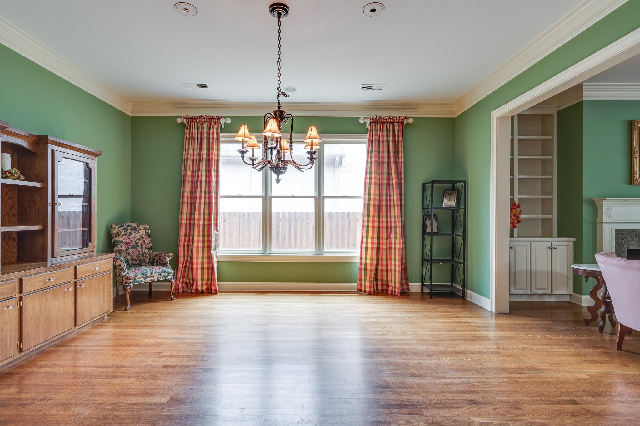 226 North White Station Road Memphis, TN 38117 - Photo 8 of 31 Dining area featuring a chandelier, hardwood / wood-style flooring, and ornamental molding