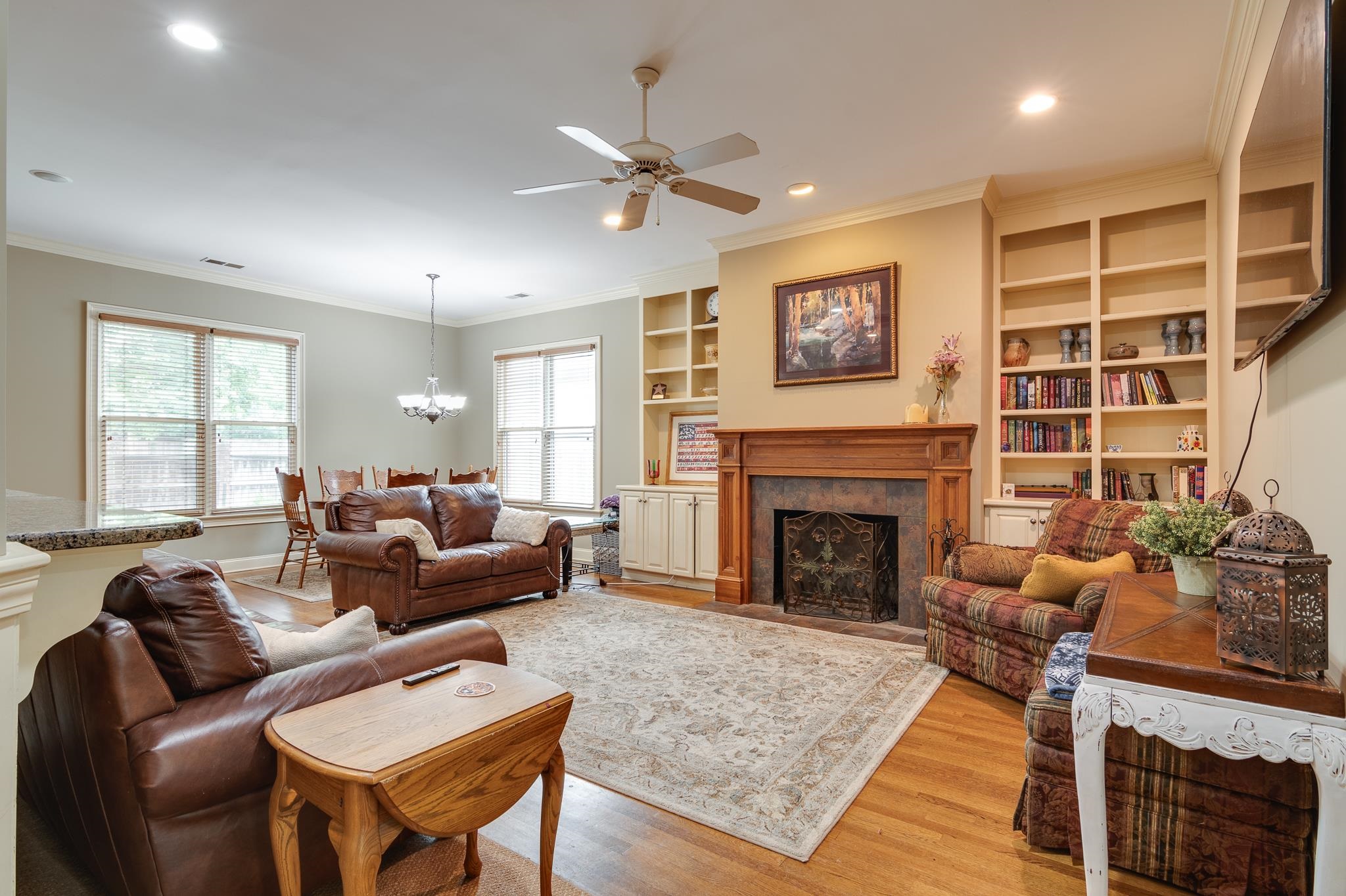 226 North White Station Road Memphis, TN 38117 - Photo 9 of 31 Living room featuring plenty of natural light, ornamental molding, light hardwood / wood-style floors, and a fireplace
