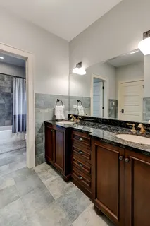 a large bathroom with a sink and a large mirror