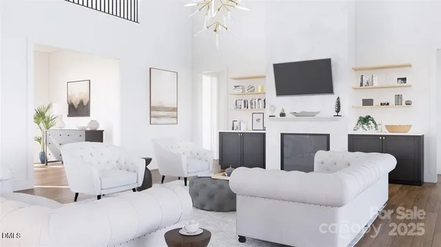 a living room with furniture a flat screen tv and white walls