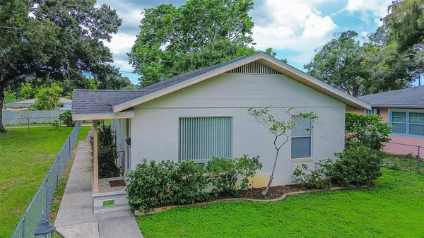 a front view of house with yard and green space