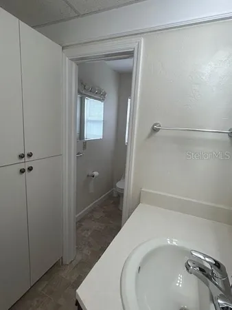a kitchen with a sink and cabinets