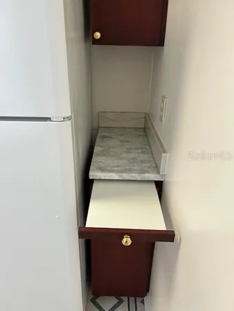 an empty room with wooden floor and closet