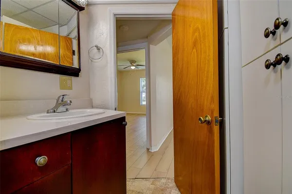 an aerial view of residential houses with outdoor space and trees