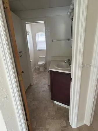 view of a hallway with wooden floor