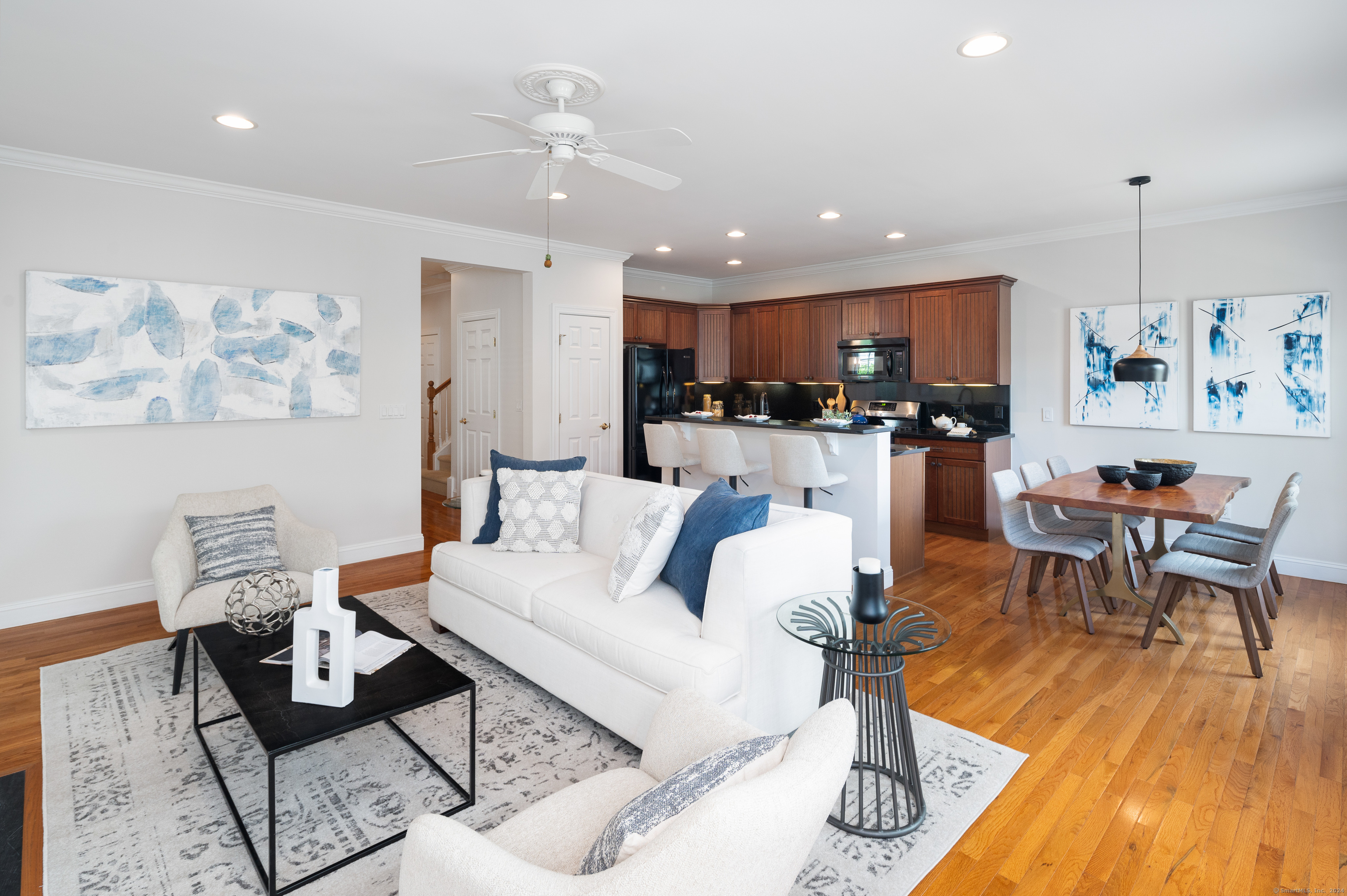 15 Mercy Street, Unit 15 Danbury, CT 06810 - Photo 1 of 1 a living room with furniture and wooden floor