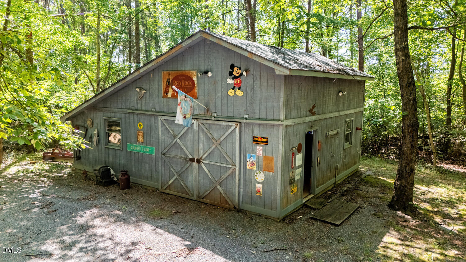 7391 Howerton Road Elon, NC 27244 - Photo 51 of 53 Wood-sided outbuilding with an A-frame roof and double barn doors